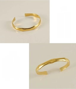 Detailed macro view of 18K gold-plated stainless steel bamboo cuff bracelet texture