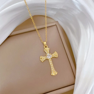 Luxurious gold titanium cross necklace with sparkling rhinestones on elegant silk