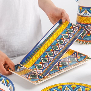 Bohemian style rectangular ceramic serving plates with hand-painted blue and yellow patterns