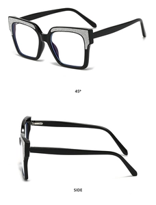 Detail view of square black frame glasses with silver glitter top and metal hinges