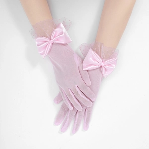 Close-up of pink mesh bridal gloves featuring satin bows and elegant dot lace details