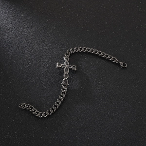 Vintage silver stainless steel cross bracelet with cuban chain for men on black background