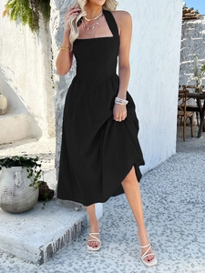 Detail of elegant black halter neck maxi dress with soft draped fabric and a-line silhouette