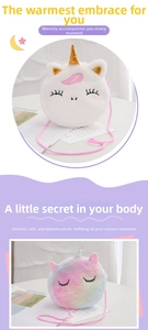 Detail of plush unicorn crossbody bags in white and rainbow colors with golden horns