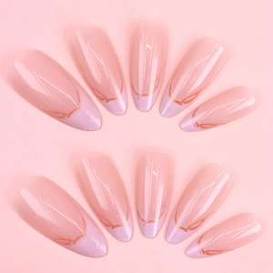 Long almond press-on nails with nude base, purple French tips and gold bow accents