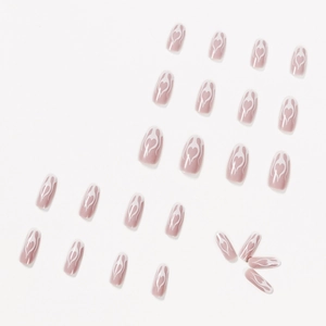 Dusty pink almond press-on nails with white flame heart patterns, 24-piece full set