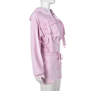 Pink velvet tracksuit detail with cropped zip hoodie and matching shorts on mannequin