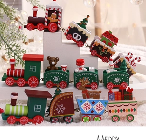 Detailed view of handcrafted wooden Christmas train featuring festive snowmen and reindeer