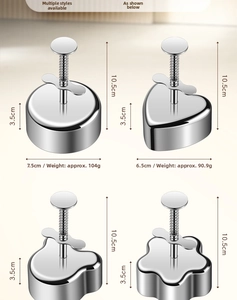 Set of four stainless steel food molds with press handles in round, heart, and flower shapes