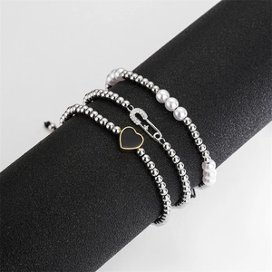 Three-piece adjustable pearl and zircon heart bracelet set in silver and gold plating