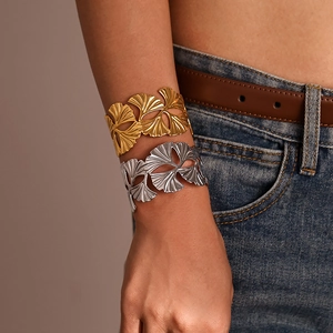 Exaggerated ginkgo leaf open bangle with hollow design in gold and silver finish