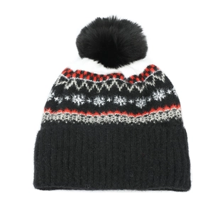 Women's Nordic pattern knit beanie with black faux fur pom pom for winter warmth