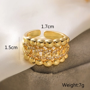Macro detail of 18K gold-plated multi-layer ring featuring sparkling zircon inlay accents