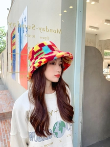 Macro detail of colorful patchwork plush bucket hat with soft faux fur texture