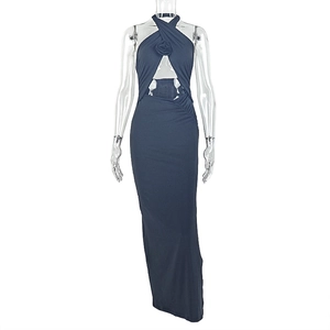 Detail of navy blue halter maxi dress with cutout waist and rose floral embellishment