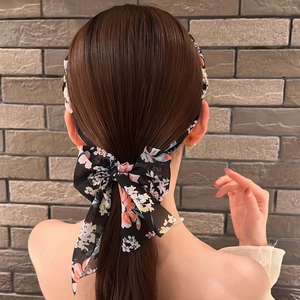 Floral chiffon bow hair tie and headband set on a model with elegant back view
