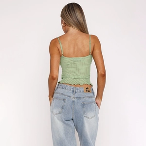 Close-up of light green camisole with backless design and lettuce hem detail