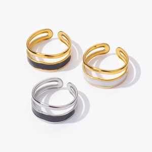 Three retro stainless steel open rings with black and white enamel in gold and silver