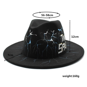 Detail view of black fedora hat featuring blue lightning patterns and Time Space print