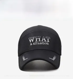 Detail of black baseball cap featuring white embroidered text and striped visor design
