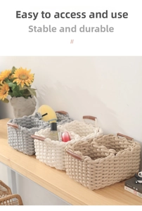 Detail of handwoven cotton storage baskets with leather handles and inner dividers