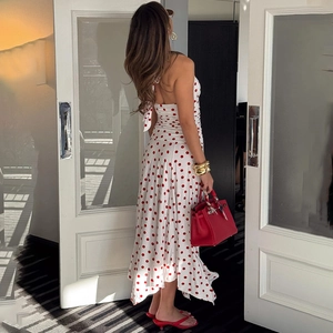 Elegant backless midi dress in white with red polka dots and tie-back detailing