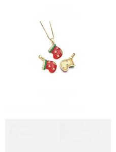 Detailed view of Christmas sock pendant made of 18K gold plated copper and red enamel