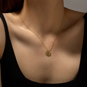 S925 Sterling Silver Evil Eye Necklace with colorful zircons on a gold chain model shot