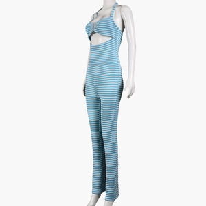 Detail view of the blue and white striped knit fabric and side waist cutout design