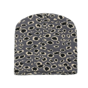 Detailed close-up of leopard jacquard knit pattern and texture on a warm winter beanie