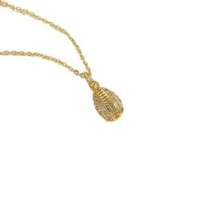 Ocean series golden rugby pendant necklace with clear zircon stones on a fine chain