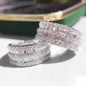 Two sparkling silver rings set with rows of cubic zirconia stones for women