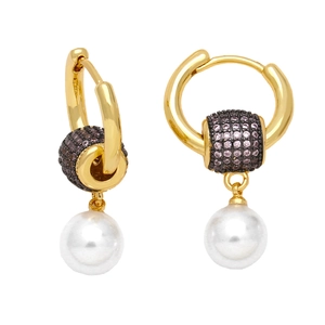 Detailed close-up of golden pearl earrings with purple and black cubic zirconia stones