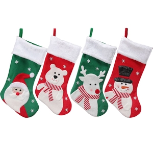 Set of four Christmas stockings with Santa, reindeer, polar bear and snowman for holiday decor