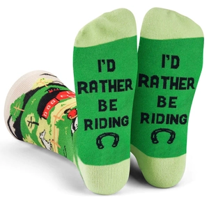 Detail of farm-themed cotton socks with horsehoe motif and 'I'D RATHER BE RIDING' text