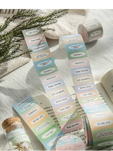 Detail of vintage-style aesthetic label tape with gradient colors and English quotes