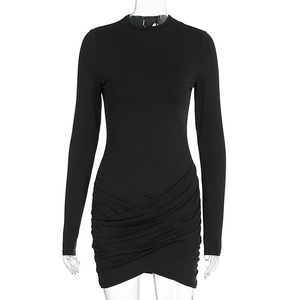Detail of ruched front panels on a black slim fit long sleeve mini dress