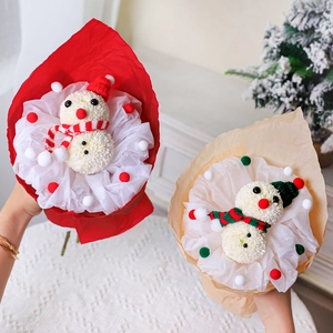 Handmade Christmas snowman flower bouquet with red hat and festive holiday wrapping