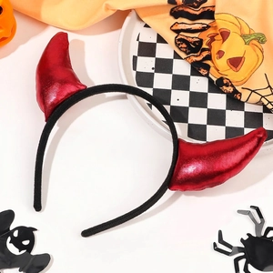Detail of Halloween devil horn headband with red patent leather on festive themed background