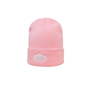 Pink knitted beanie hat featuring a white cloud embroidery and a thick ribbed cuff