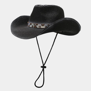 Detail of black straw cowboy hat with leopard print band and adjustable chin strap