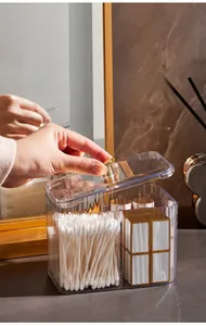 Close-up of clear acrylic organizer with vertical stripes, gold handle and dual compartments