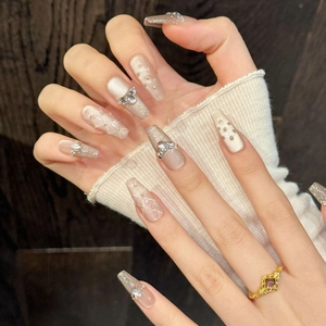 Details von Sarg-förmigen Press-on-Nägeln mit Champagner-Gold Cat-Eye Finish und 3D Bogen