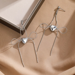Silver heart earrings with snake chain bow and long fringe tassels on silk