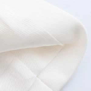 Macro detail of white twill fabric texture and thickness for two-piece vest shorts set