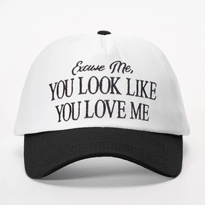 Classic black and white contrast baseball cap with 'YOU LOOK LIKE' artistic embroidery