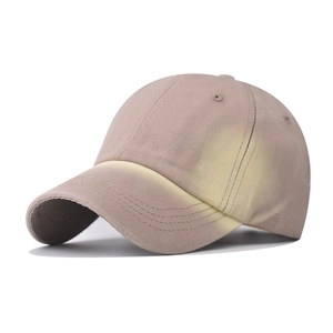 Detail view of pink and yellow gradient washed denim baseball cap with reinforced stitching