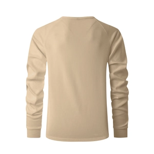Detailed close-up of khaki waffle knit fabric and raglan sleeve stitching on men's shirt