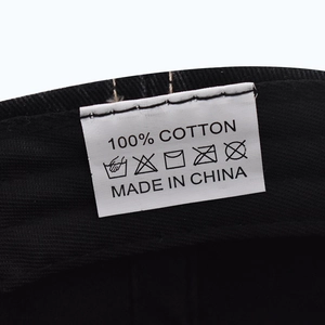 Close-up of the 100% cotton material care label inside the New York baseball cap