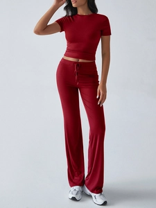 Detail view of red short-sleeve T-shirt and drawstring wide-leg pants two-piece set
